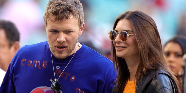 (Left to right) Sebastian Bear-McClard and Emily Ratajkowski at the big game. (Photo by Rob Carr/Getty Images)