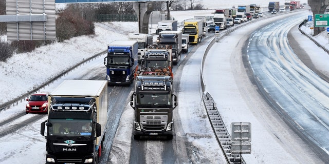 Authorities across eastern Europe have issued warnings for strong winds, heavy rain and snow that toppled trees, damaged buildings and closed roads throughout the region.