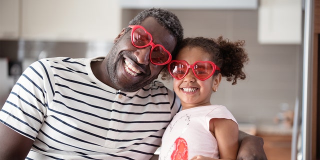 Father and daughter enjoy some Valentine's Day togetherness in this image. How will you spend the holiday this year?