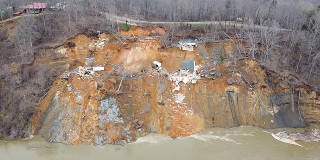 Two homes collapsed into the rain-swollen Tennessee River, the Hardin County Fire Department reported. Homeowners were evacuated from the first house and the second home was unoccupied, officials said. (Hardin County Fire Department)