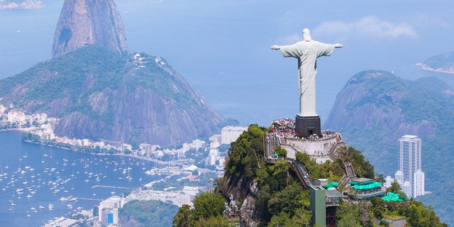 Christ the Redeemer overlooks Rio de Janeiro from atop Corcovado mountain.