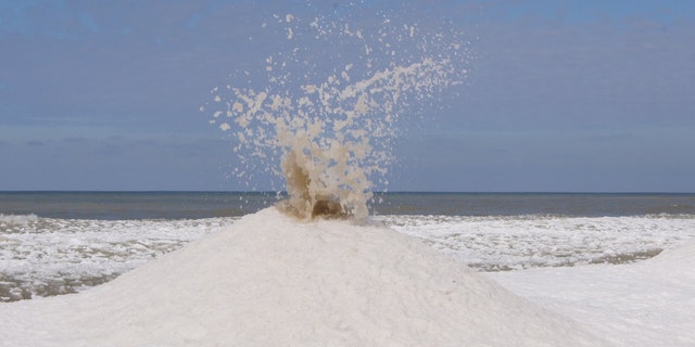 "Ice volcanoes" tend to occur on locations on the shoreline where waves strike with force.
