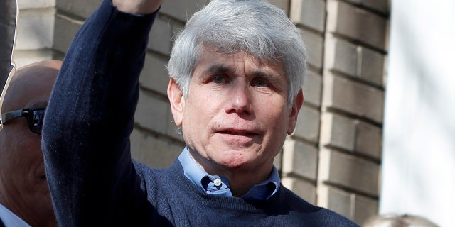 Former Illinois Gov. Rod Blagojevich and his wife Patti wave to supporters after a news conference outside his home Wednesday, Feb. 19, 2020, in Chicago. On Tuesday, President Donald Trump commuted his 14-year prison sentence for political corruption. (AP Photo/Charles Rex Arbogast)