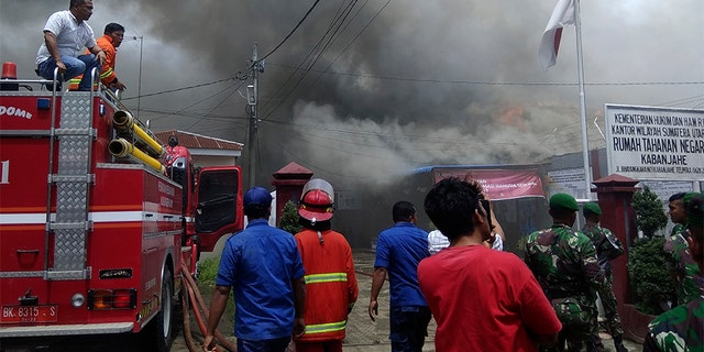 Angry inmates set fire to the overcrowded prison on Indonesia's Sumatra island during a riot that erupted Wednesday, officials said. (AP)