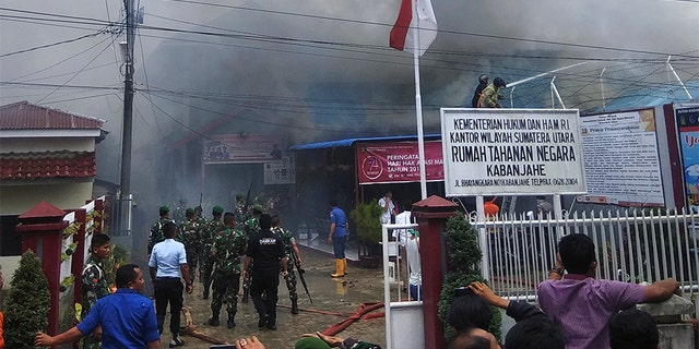 Smoke billows from Kabanjahe prison during a prison riot Wednesday. (AP)