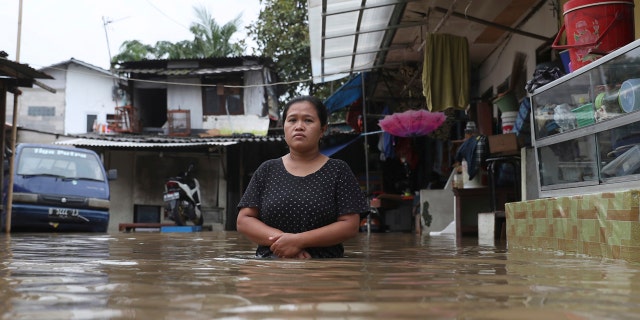 Overnight rains caused rivers to burst their banks in greater Jakarta sending muddy water into residential and commercial areas, inundating thousands of homes and paralyzing parts of the city's transport networks, officials said.
