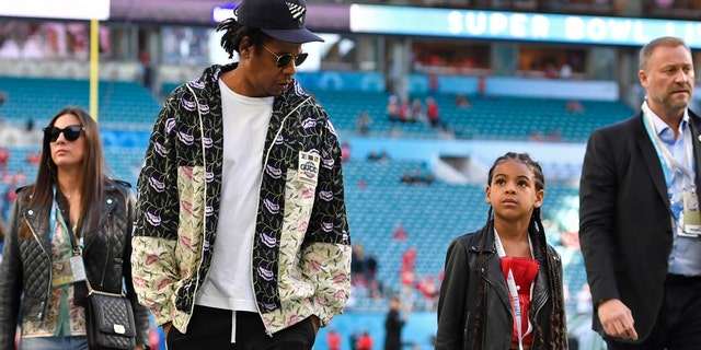 Jay-Z walks with his daughter Blue Ivy Carter. (Jose Carlos Fajardo/MediaNews Group/The Mercury News via Getty Images)