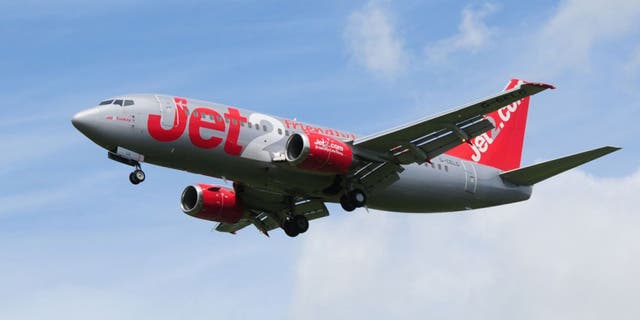 A woman will spend two years in jail after threatening to “kill” everyone on board a Jet2 flight last summer and attempting to open the emergency exit.