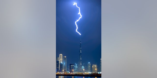 Storm chaser Zohaib Anjum snapped the extraordinary moment during high winds in Dubai. "Ribbon lightning" occurs when multiple return pulses of electricity in the same ionized channel are separated by the wind, even though they occur within tens of milliseconds of each other. (Credit: SWNS)