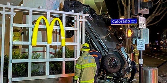 In this early Sunday, Feb. 23, 2020 photo released by the Santa Monica Fire Department shows a vehicle that plunged into the sidewalk in Santa Monica, Calif. (Santa Monica Fire Department via AP)