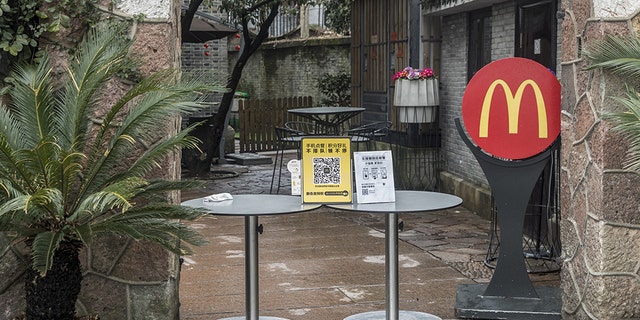 An entrance to a closed McDonald's Corp. restaurant is barricaded near the famous West Lake, usually a popular tourist attraction, in Hangzhou, China, on Tuesday, Feb. 11, 2020. The death toll from the coronavirus climbed above 1,000, as the Chinese province at the epicenter of the outbreak reported its highest number of fatalities yet. Photographer: Qilai Shen/Bloomberg via Getty Images