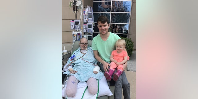 Callie Colwick in hospital with Kevin and Kenzi Colwick. (SWNS)