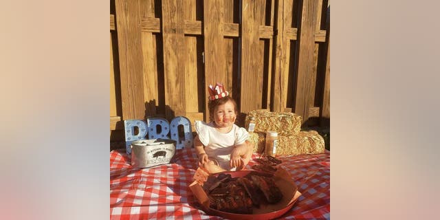 Paul and his wife Denise planned the special barbecue-themed birthday photo shoot, feeling it was more representative of their family than a traditional smash cake.