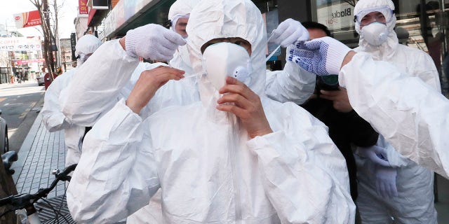 The White House on Saturday announced travel restrictions for South Korea, Iran and Italy over the coronavirus outbreak. (AP Photo/Ahn Young-joon)