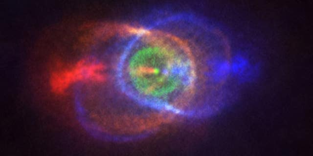 The Atacama Large Millimeter/submillimeter Array captured the bright blue and red clouds of gas surrounding the binary star system known as HD101584.