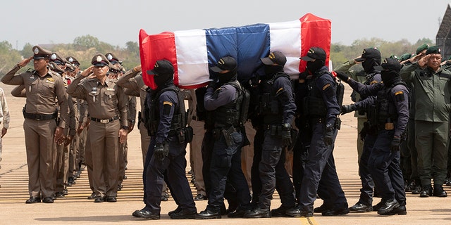 Members of the Thai special forces carry the coffin a fellow officer killed in a mass shooting, at a military airport in Nakhon Ratchasima, Thailand, on Monday. (AP)