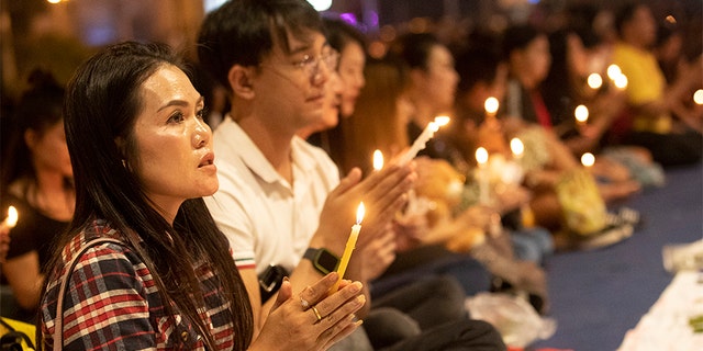 People attend a memorial service at the Terminal 21 Korat shopping mall in Nakhon Ratchasima, Thailand, on Monday. (AP)