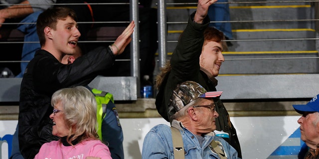 Protesters are led out of the World Ice Arena as President Trump speaks at a campaign rally Thursday, Feb. 20, 2020, in Colorado Springs, Colo. (Associated Press)