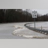 Strong currents from the swollen Pearl River flood over the Old Brandon Road Bridge in Jackson, Miss., Sunday.