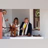 President Donald Trump, with first lady Melania Trump, and Indian Prime Minister Narendra Modi, look at a Charkha, or a spinning wheel, during a tour of Gandhi Ashram, in Ahmedabad.