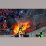 A small group of anti-government protesters set a section of the stadium on fire during the Copa Libertadores soccer game between Universidad de Chile and Brazil's SC Internacional, in Santiago, Chile, Feb. 4, 2020.