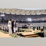 President Donald Trump, first lady Melania Trump, and Indian Prime Minister Narendra Modi arrive on stage at Sardar Patel Stadium in Ahmedabad, India.
