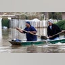 Jackson, Miss., homeowners use shovels as oars to work their way through Pearl River floodwater in this Jackson, Miss., neighborhood Sunday.?