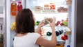 Rear View Of A Young Woman Taking Food From Refrigerator - Fox News