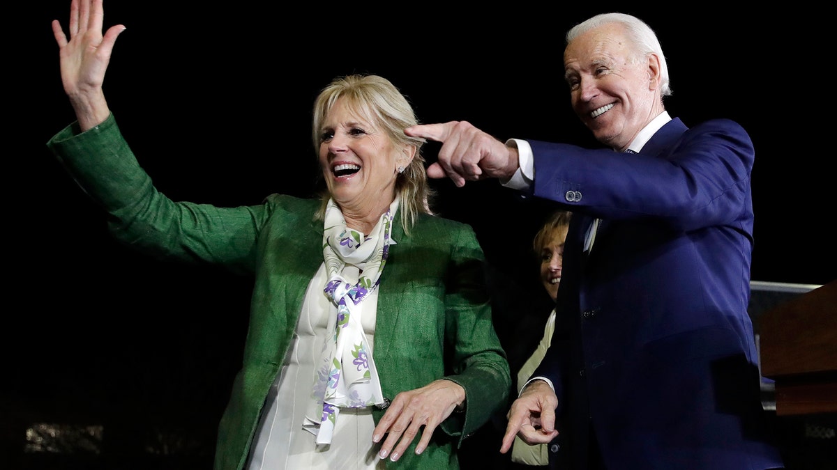 Democratic presidential candidate former Vice President Joe Biden, right, and his wife Jill attend a primary election night rally Tuesday, March 3, 2020, in Los Angeles. (AP Photo/Marcio Jose Sanchez)