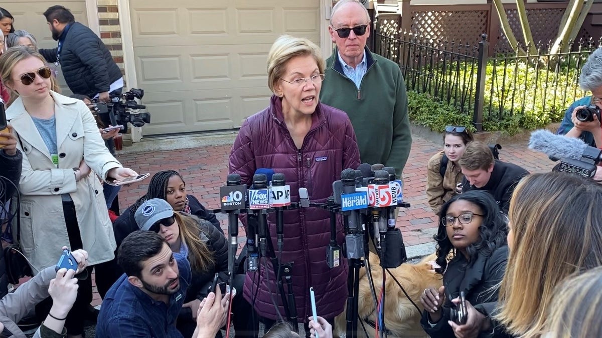 Sen. Elizabeth Warren speaks with reporters outside her home in Cambridge, Massachusetts on March 5, 2020, after announcing she was ending her presidential campaign