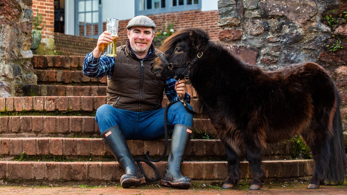 "The daily pub visit is all part of his routine and is his highlight. He likes a sip of Guinness and he has a carrot — that's it," says Kirk Petrakis of his pet pony Patrick.