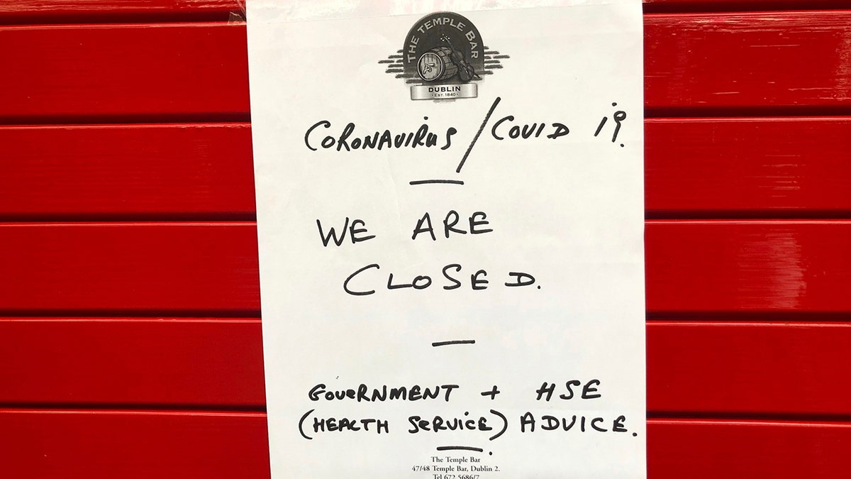 A sign on the door of The Temple Bar announced it would be closed with immediate effect amid coronavirus fears.