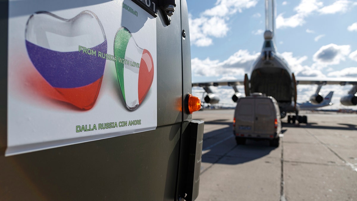 A sign on a Russian military vehicle reads: "From Russia with love" in several languages. (Alexei Yereshko, Russian Defense Ministry Press Service via AP)