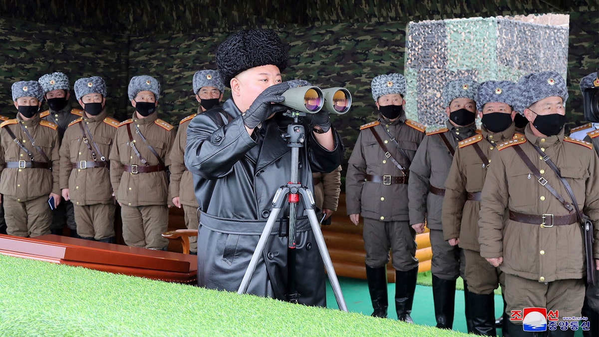 In this Friday, Feb. 28, 2020, file photo provided on Feb. 29, 2020 by the North Korean government, North Korean leader Kim Jong Un, center, inspects the military drill of units of the Korean People's Army, with soldiers shown wearing face masks. (Korean Central News Agency/Korea News Service via AP, File)