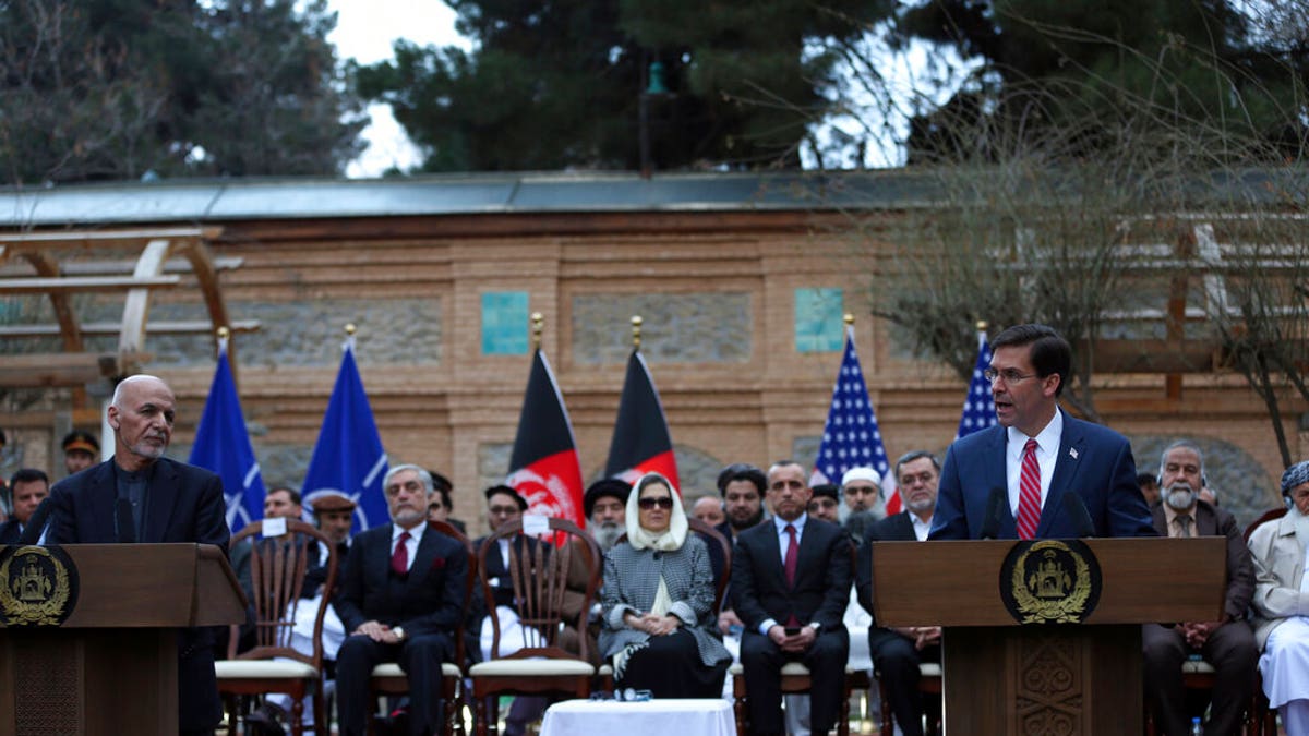 U.S. Secretary of Defense Mark Esper, right, and Afghan President Ashraf Ghani, speaks during a joint news conference in presidential palace in Kabul, Afghanistan, Saturday, Feb. 29, 2020. 
