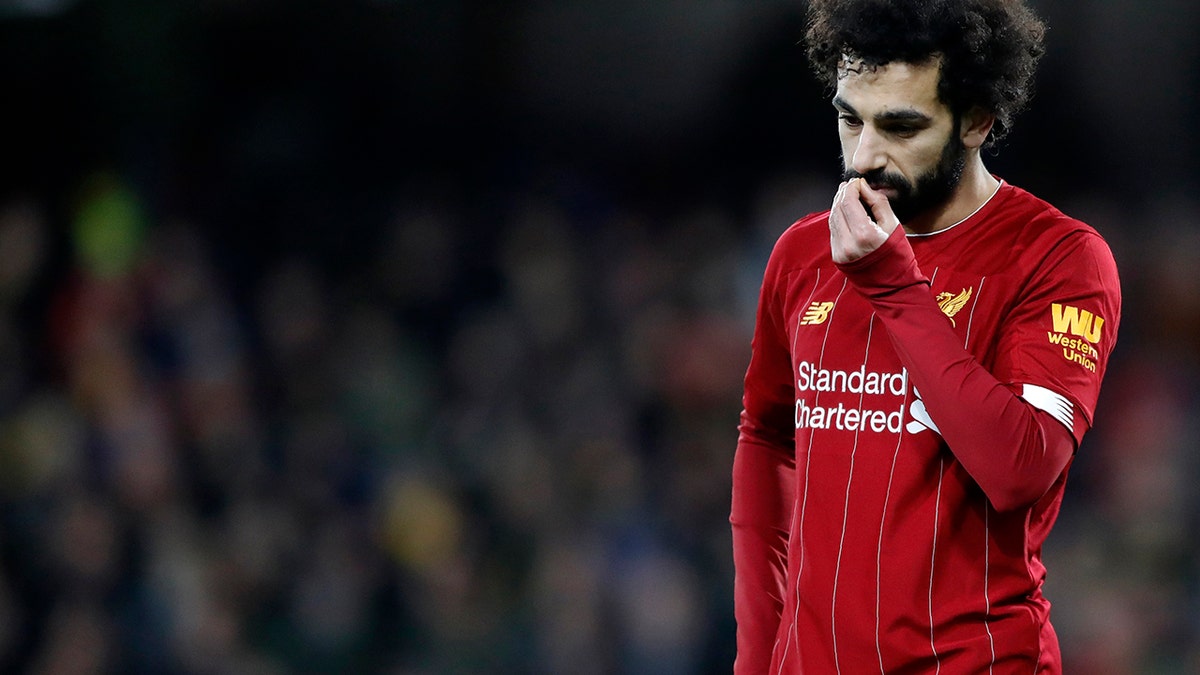 Liverpool's Mohamed Salah leaves the field at the end of the English Premier League soccer match between Watford and Liverpool at Vicarage Road stadium, in Watford, England, Saturday, Feb. 29, 2020. The match finished 3-0. (AP Photo/Alastair Grant)