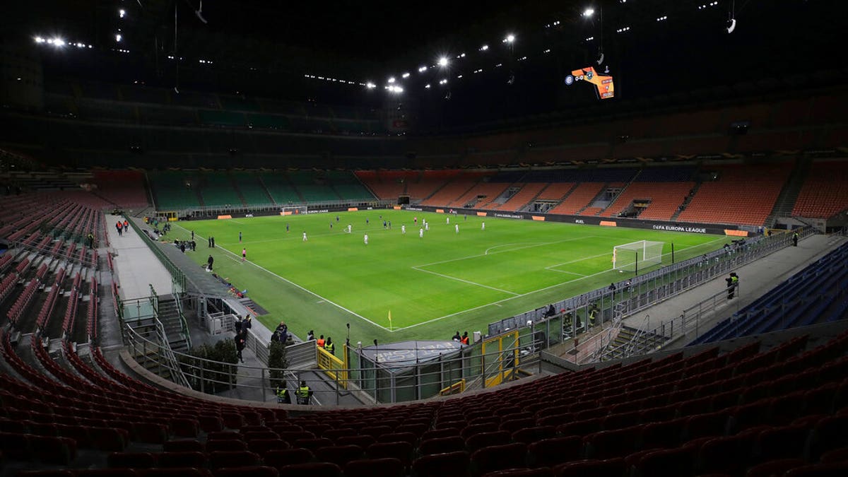 The seats are empty as a precaution against the coronavirus at the San Siro stadium in Milan, Italy, during the Europa League round of 32 second leg soccer match between Inter Milan and Ludogorets.