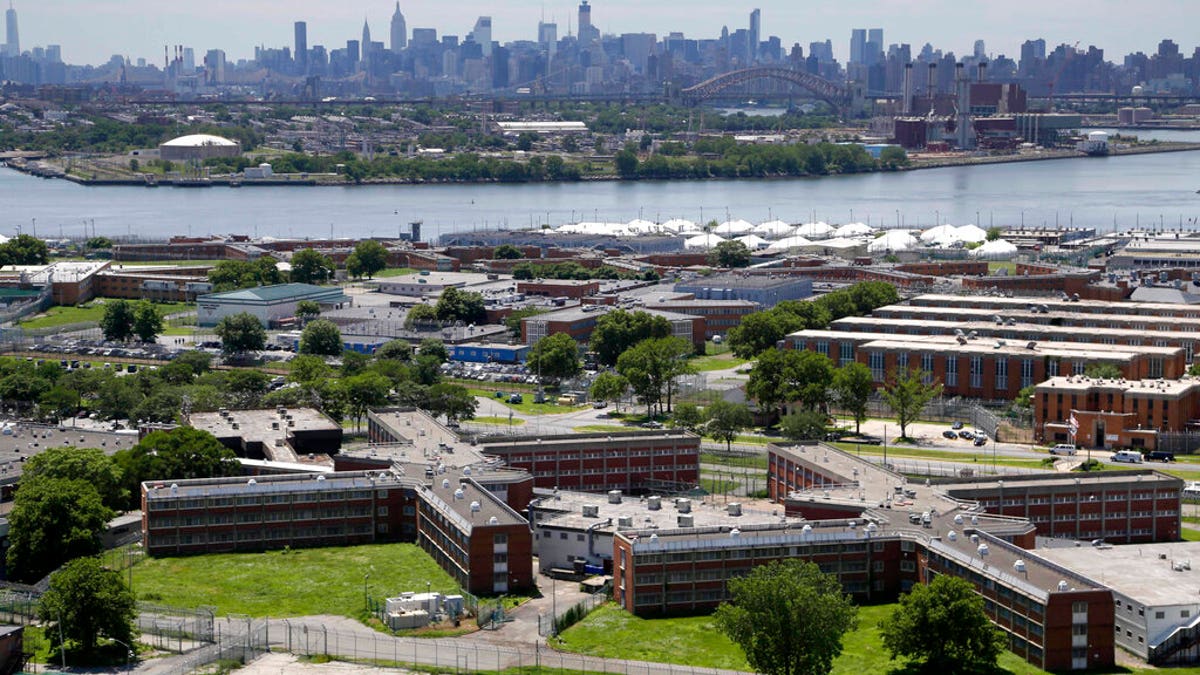 FILE - In a June 20, 2014, file photo, the Rikers Island jail complex stands in New York with the Manhattan skyline in the background.<br data-cke-eol="1">
(AP Photo/Seth Wenig, File)