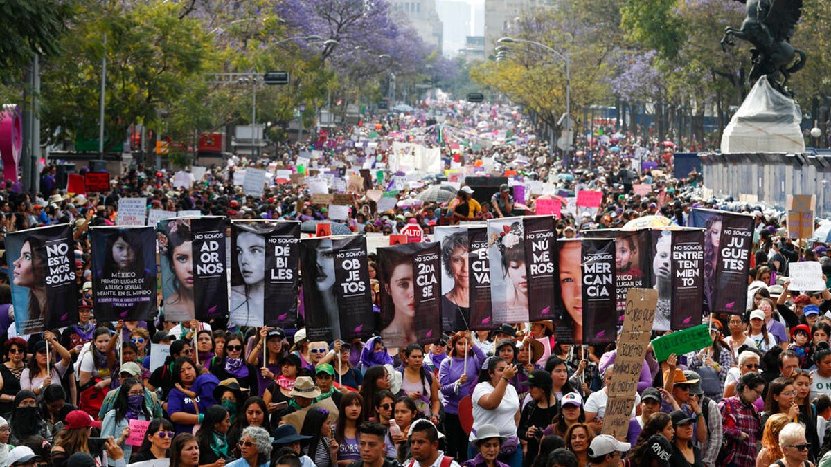 Women march during International Women's Day in Mexico City, Sunday, March 8, 2020.