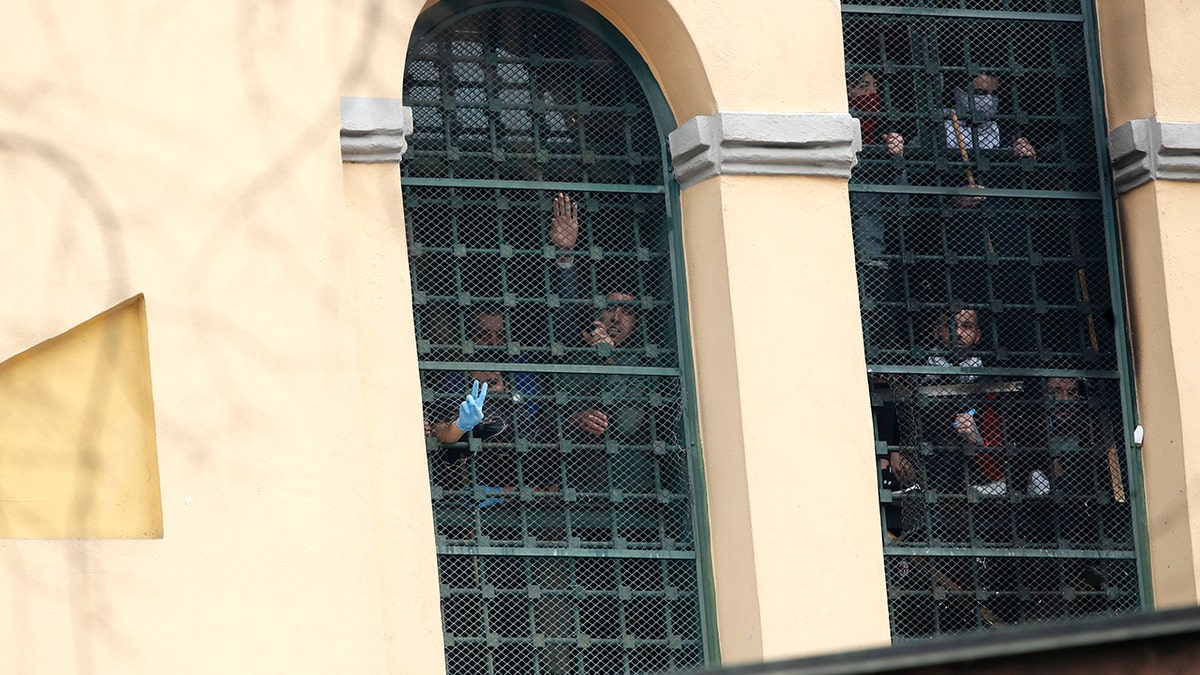 Inmates stage a protest against new rules to cope with coronavirus emergency, at the San Vittore prison in Milan, Italy, Monday, March 9, 2020. Italy took a page from China's playbook Sunday, attempting to lock down 16 million people — more than a quarter of its population — for nearly a month to halt the relentless march of the new coronavirus across Europe. (AP Photo/Antonio Calanni)