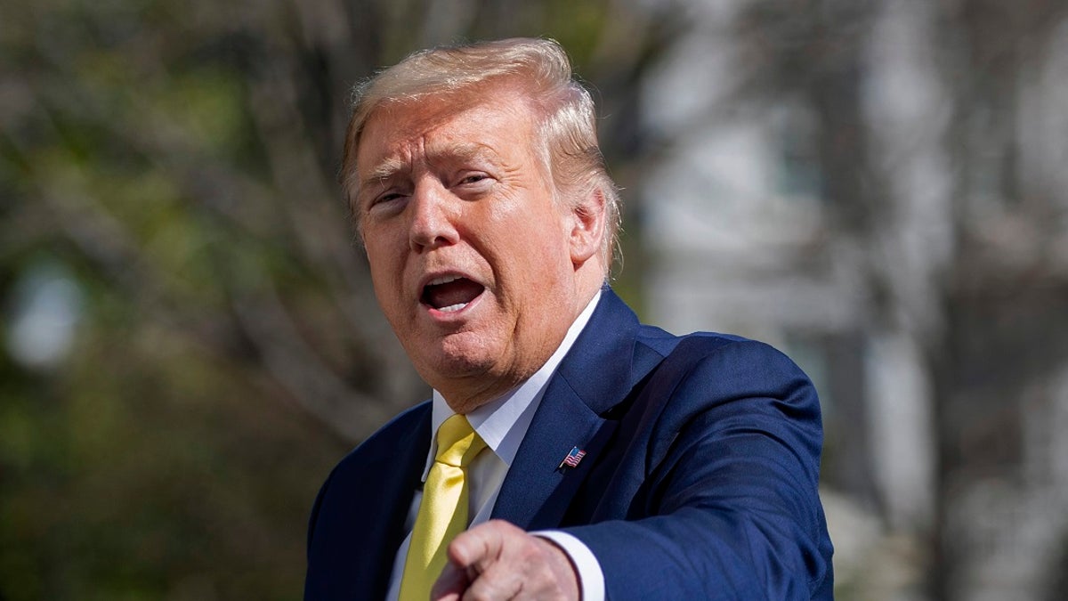 President Donald Trump gestures while walking on the South Lawn of the White House in Washington on Monday after stepping off Marine One. A “Women for Trump” bus tour has been canceled, the president’s campaign said, citing scheduling conflicts. (AP Photo/Patrick Semansky)