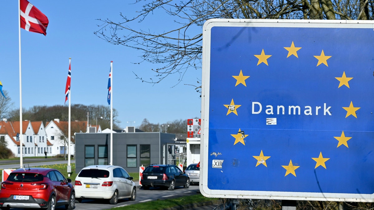 Cars drive north to the German-Danish border crossing near Flensburg, Germany, Saturady, March 14, 2020. Denmark closes its borders from noon in the Coronavirus crisis until further notice. (Carsten Rehder/dpa via AP)