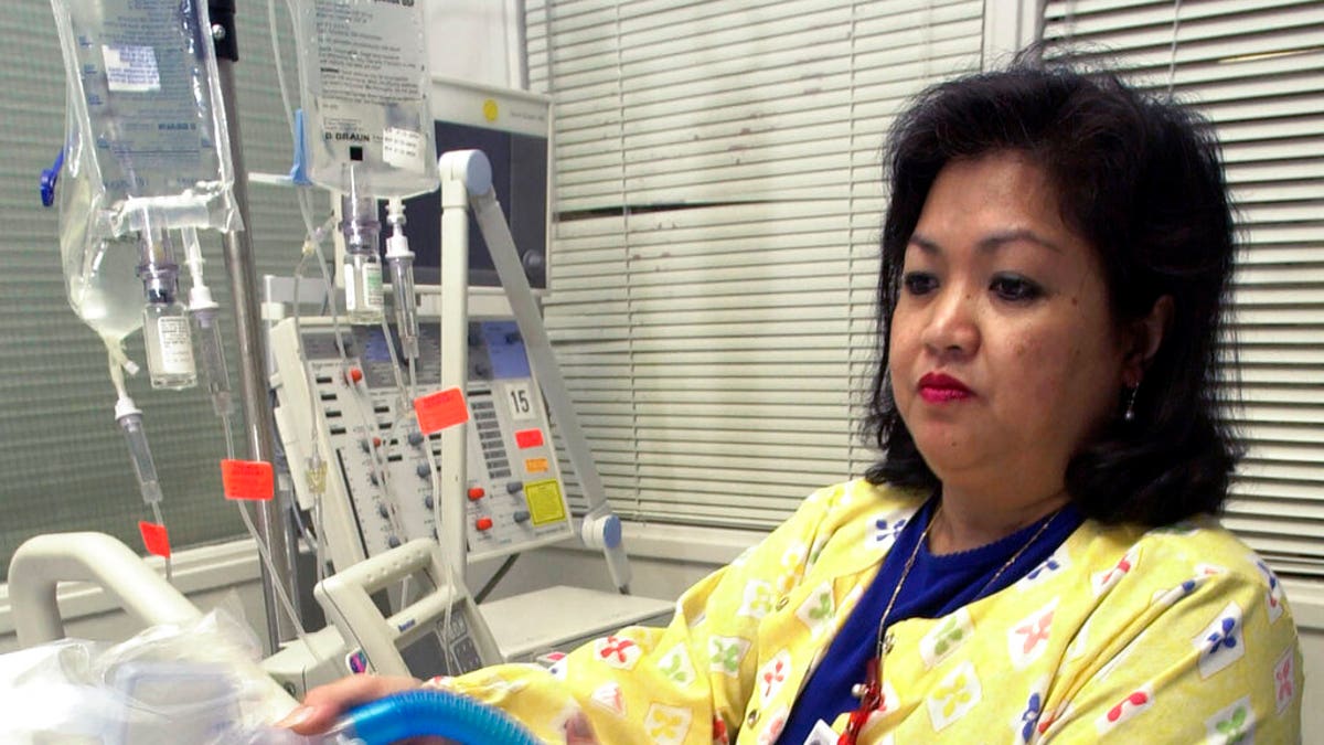 FILE: Lovely R. Suanino, a respiratory therapist at Newark Beth Israel Medical Center in Newark, N.J., demonstrates setting up a ventilator in the intensive care unit of the hospital. 