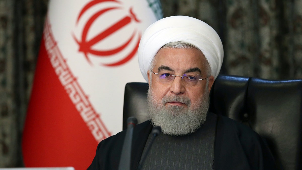 President Hassan Rouhani attends a cabinet meeting in Tehran, Iran, on March 18. He criticized President Trump on Wednesday and promised the country would give a "crushing response" if the arms embargo on Tehran is extended, according to a report. (Office of the Iranian Presidency via AP)