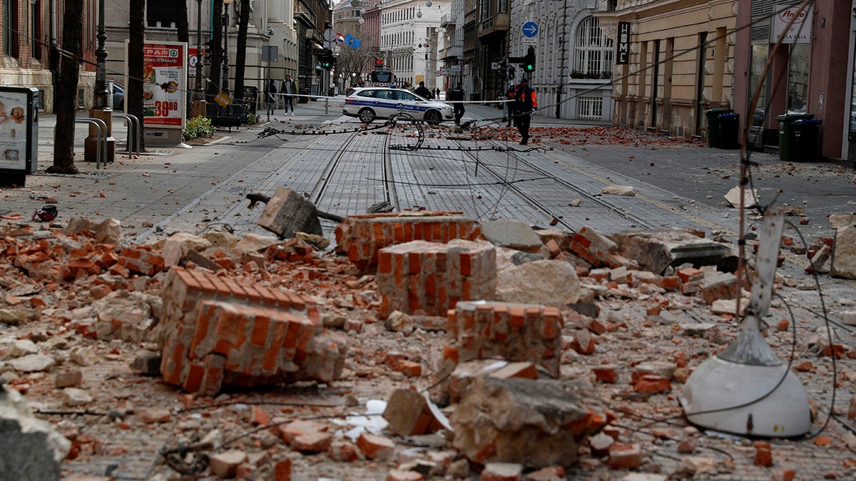 Police guard a street after an earthquake in Zagreb, Croatia, Sunday, March 22, 2020. A strong earthquake shook Croatia and its capital on Sunday, causing widespread damage and panic.(Associated Press)