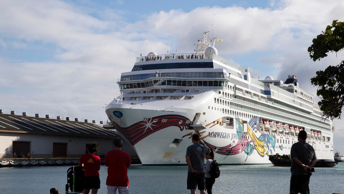 The Norwegian Jewel cruise ship docks at Honolulu Harbor on March 22. The cruise ship that had to cut short its trip because of the new coronavirus and mechanical problems docked Sunday in Honolulu's harbor. (Cindy Ellen Russell/Honolulu Star-Advertiser via AP)