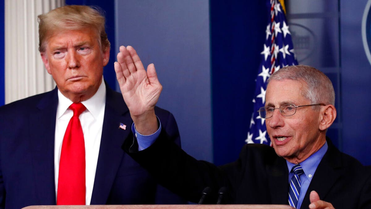 President Trump with Dr. Anthony Fauci, the director of the National Institute of Allergy and Infectious Diseases, during a briefing at the White House on Tuesday. (AP Photo/Alex Brandon)