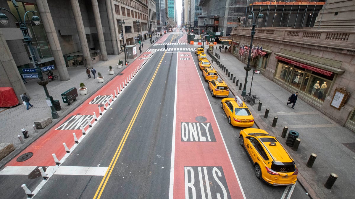 Yellow cabs line an empty 42nd St. waiting for fares outside Grand Central Terminal, Wednesday, March 25, 2020, in New York. Hospitalizations from COVID-19 were rising faster than expected in New York as residents and leaders prepared for a peak in cases that is expected to still be weeks away. Temporary hospitals, and even a morgue in Manhattan, are being setup. 