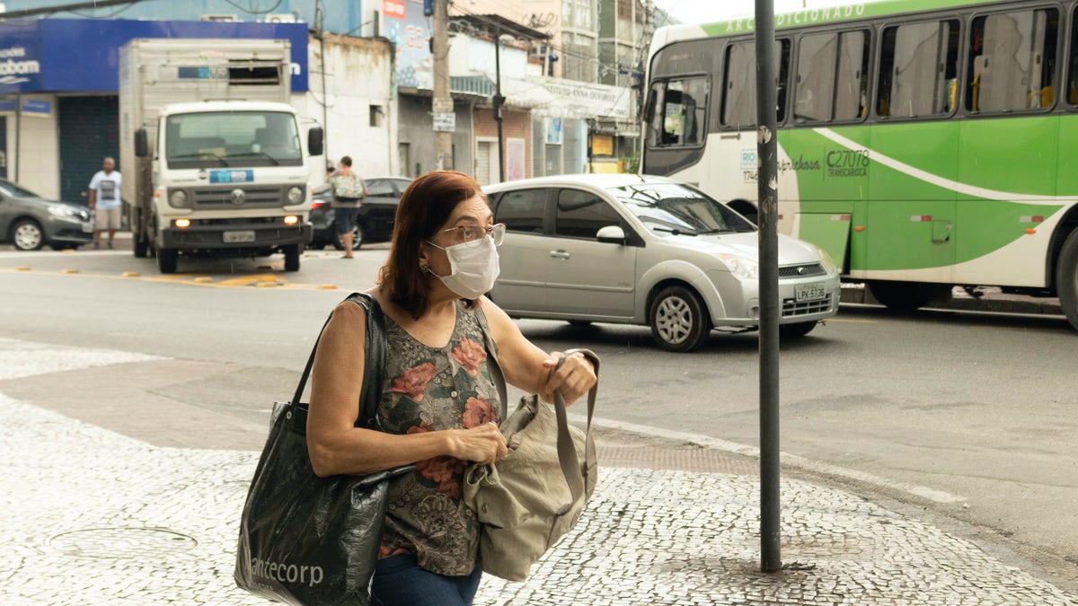 A woman walks in the streets of the North Zone of Rio de Janeiro during the quarantine against the new coronavirus. 