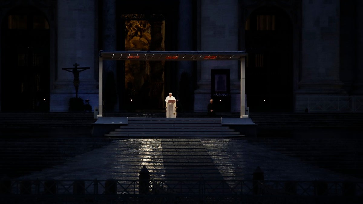 Pope Francis delivers the Urbi and Orbi prayer (Latin for To the City and To the World) in an empty St. Peter's Square, at the Vatican on Friday. Praying in a desolately empty St. Peter's Square, Pope Francis on Friday likened the coronavirus pandemic to a storm laying bare illusions that people can be self-sufficient and instead finds "all of us fragile and disoriented" and needing each other's help and comfort. (AP Photo/Alessandra Tarantino)